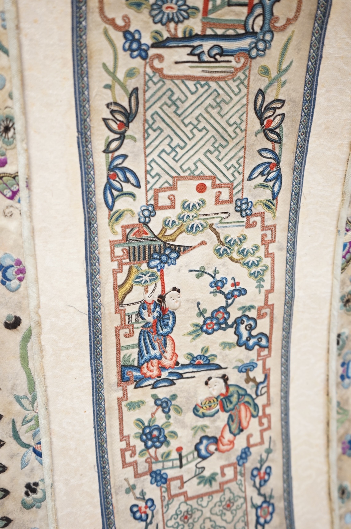 A pair of Chinese silk embroideries, in scroll form